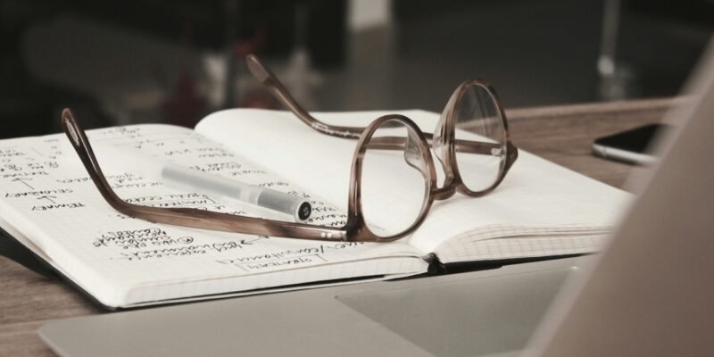 eyeglasses with gray frames on the top of discussion points